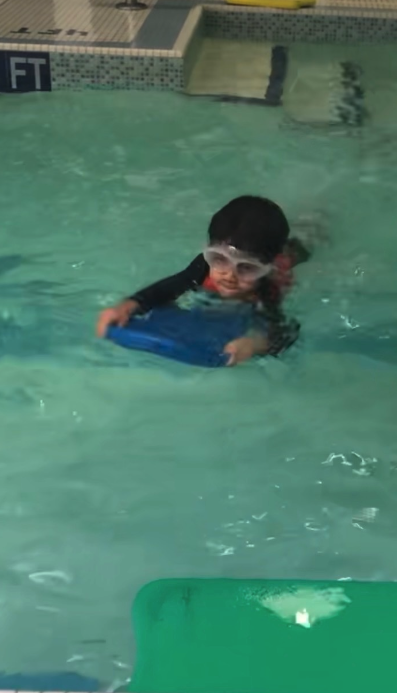 Child learning to swim